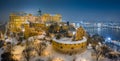 Budapest, Hungary - Aerial view of illuminated Buda Castle Royal Palace on a winter night with snowy park Royalty Free Stock Photo