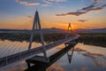 Budapest, Hungary - Aerial view of Megyeri suspension bridge at sunset with beautiful blue and golden sky