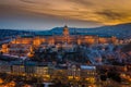 Budapest, Hungary - Aerial view of the snowy Buda Castle Royal Palace with beautiful golden sunset