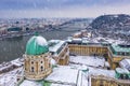 Budapest, Hungary - Aerial view of the snowy Buda Castle Royal Palace with Statue of Liberty, Elisabeth and Liberty Bridge Royalty Free Stock Photo