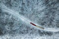 Budapest, Hungary - Aerial view of snowy forest with red train on a track at winter time Royalty Free Stock Photo