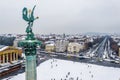 Budapest, Hungary - Aerial view of the snowy Heroes` Square with angel sculpture and Andrassy street Royalty Free Stock Photo