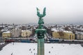 Budapest, Hungary - Aerial view of the snowy Heroes ` Square with angel sculpture, busses and Andrassy street Royalty Free Stock Photo