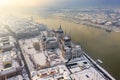 Budapest, Hungary - Aerial view of the snowy Parliament of Hungary by River Danube on a foggy winter morning Royalty Free Stock Photo