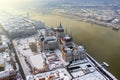 Budapest, Hungary - Aerial view of the snowy Parliament of Hungary by River Danube on a foggy winter morning Royalty Free Stock Photo