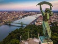 Budapest, Hungary - Aerial view of the Statue of Liberty at sunset with skyline of Budapest