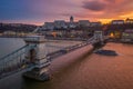 Budapest, Hungary - Aerial view of Szechanyi Chain Bridge and Buda Castle Royal Palace with a beautiful dramatic golden sunset Royalty Free Stock Photo