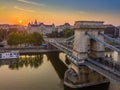 Budapest, Hungary - Aerial view of the Szechenyi Chain Bridge at sunrise with St. Stephen`s Basilica Royalty Free Stock Photo