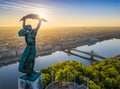 Budapest, Hungary - Aerial view from the top of Gellert Hill with Statue of Liberty, Liberty Bridge and skyline of Budapest