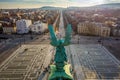 Budapest, Hungary - Angel sculpture from behind on the top of Heroes` Square at sunset Royalty Free Stock Photo