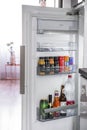 Budapest, Hungary - April 18, 2019: Door of opened fridge stacked with alcoholic and non-alcoholic drinks