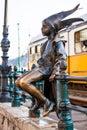 The famous Little Princess statue created by Laszlo Marton sitting on the railings of the Danube promenade in Budapest