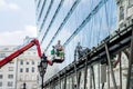 Workman washing the building`s window glass Royalty Free Stock Photo