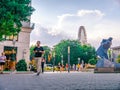 View on the people walking on the Deak Ferenc square with the Budapest Eye wheel is in the background Royalty Free Stock Photo