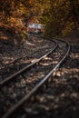 Budapest, Hungary - Beautiful autumn scenery with the Children`s train on the S curve track in the Hungarian woods of Huvosvolgy Royalty Free Stock Photo