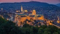 Budapest, Hungary - The beautiful Buda Castle Royal Palace and Matthias Church at magic hour Royalty Free Stock Photo