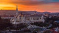 Budapest, Hungary - Beautiful dramatic golden sunset behind the famous Fisherman`s Bastion Halaszbastya and Matthias Church Royalty Free Stock Photo