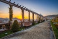 Budapest, Hungary - Beautiful sunrise at Varkert Bazaar with bench, Statue of Liberty at background