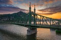 Budapest, Hungary - Beautiful sunset over River Danube with Liberty Bridge, Gellert Hill and Statue of Liberty Royalty Free Stock Photo