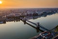 Budapest, Hungary - Beautiful Szechenyi Chain Bridge over River Danube at sunrise with St. Stephen`s Basilica Royalty Free Stock Photo