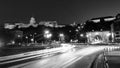 Car traffic trail lights with illuminated Chain bridge and Buda Castle in Budapest, Hungary at night. Black and white Royalty Free Stock Photo