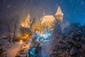 Budapest, Hungary - Christmas market in snowy City Park Varosliget from above at night with snowy trees Royalty Free Stock Photo