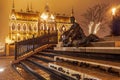 Budapest, Hungary night view of famous poet Attila Jozsef bronze statue before the illuminated Gothic style