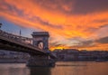 Budapest, Hungary - Dramatic orange sunset with beautiful clouds, Szechenyi Chain Bridge Royalty Free Stock Photo