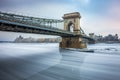 Budapest, Hungary - The famous Szechenyi Chain Bridge on the icy River Danube Royalty Free Stock Photo