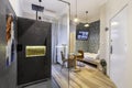 Budapest, Hungary - February 16, 2020: Luxurious tiny home space with a shower cabin outside the bathroom