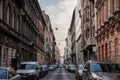 Panorama of a typical street of the city center of Budapest, Hungary, with cars park and residential buildings. Royalty Free Stock Photo