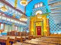 The prayer hall of Kazinczy Street Synagogue with lines of wooden benches and the Eastern Wall, on February 23 in Budapest,