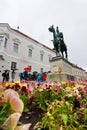 Flowerbed with violet flowers at monument to count Andras Hadik by sculptor Giorgio Vasta in Uri street, Budapest, Hungary