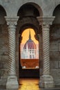 Budapest, Hungary - Golden sunrise at the Hungarian Parliament seeing through a medieval balcony