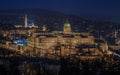 Budapest, Hungary - The illuminated Historic Buda Castle Royal Palace with Matthias Church and Buda Hills at background at dusk Royalty Free Stock Photo