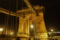 Budapest, Hungary illuminated night view detail of 19th-century suspension Szechenyi Chain Bridge, without crowd or traffic Royalty Free Stock Photo