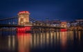 Budapest, Hungary - Illuminated Szechenyi Chain Bridge at dusk on a winter evening with Buda Castle Royal Palace at background Royalty Free Stock Photo