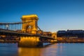 Budapest, Hungary - Illuminated Szechenyi Chain Bridge over River Danube and Buda Castle Royal Palace Royalty Free Stock Photo