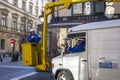 BUDAPEST, HUNGARY - JANUARY, 2017: Worker replacing old bulbs in the lantern street lighting with new ones.