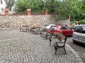 Benches on stone cobblestones near Varosmajor park in Budapest