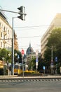 BUDAPEST, HUNGARY - JULY 24, 2016: A crossroad of Budapest with plenty of signs, a street light, a tram and a view to Parliament