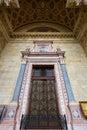 Medallions on wooden door showing busts of the 12 apostles at St. Stephen`s Basilica in Budapest, Hungary