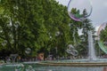 Budapest, Hungary - July 13, 2019 People are enjoying water fountain with colourful soap bubble with family members during the