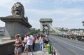 Budapest / Hungary - July 28 2019: The Szechenyi Chain Bridge crossing the Danube River in Budapest. Group of tourist people