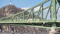 Budapest, Hungary. The Liberty Bridge or Freedom Bridge across the river Danube. Yellow tram is riding on the bridge Royalty Free Stock Photo