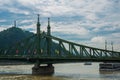 Budapest, Hungary: Liberty bridge over the Danube river. Liberty Statue or Freedom Statue stands on Gellert Hill Royalty Free Stock Photo