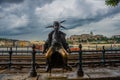 BUDAPEST, HUNGARY: The little princess Jester statue is perched by the tram rails on the Pest, Buda Castle by Danube riverbank in