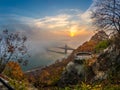 Budapest, Hungary - Lookout on Gellert Hill with Liberty Bridge Szabadsag Hid, fog over River Danube, colorful sky and clouds Royalty Free Stock Photo