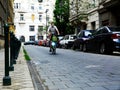 cyclist riding on gray stone paved street of Budapest during the Covid-19 pandemic