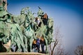 Budapest, Hungary - March 04, 2012. Teenagers climbing up statues on Heroes` Square, Hosok Tere